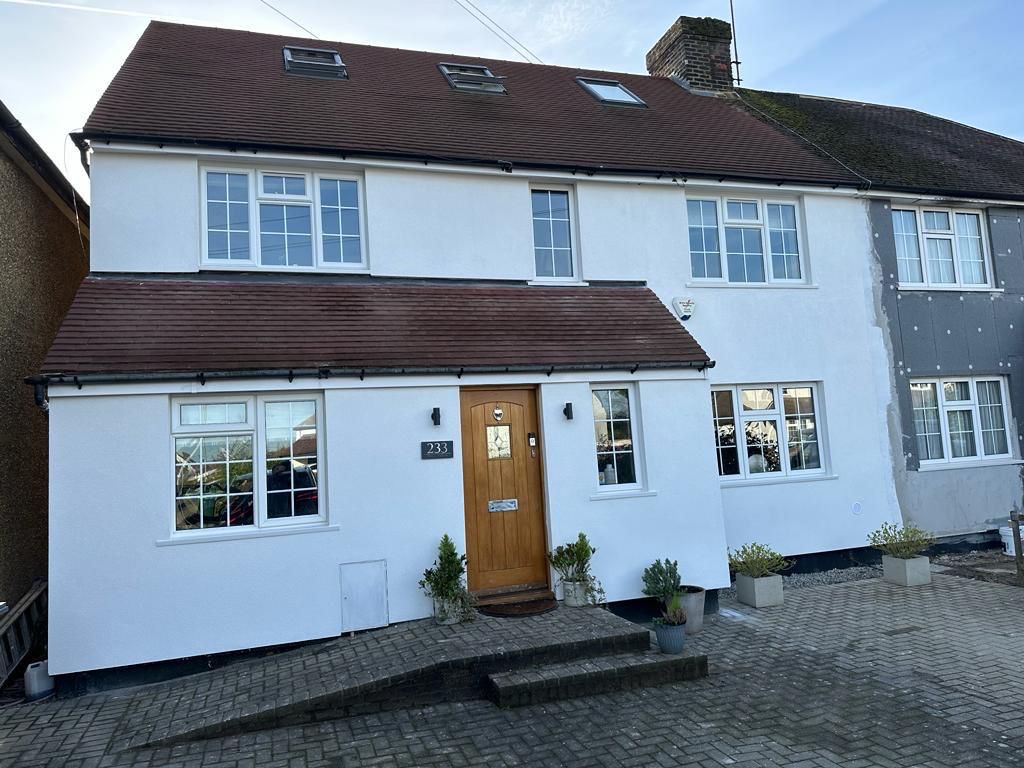 Completed white rendered exterior elevation of a residential house
