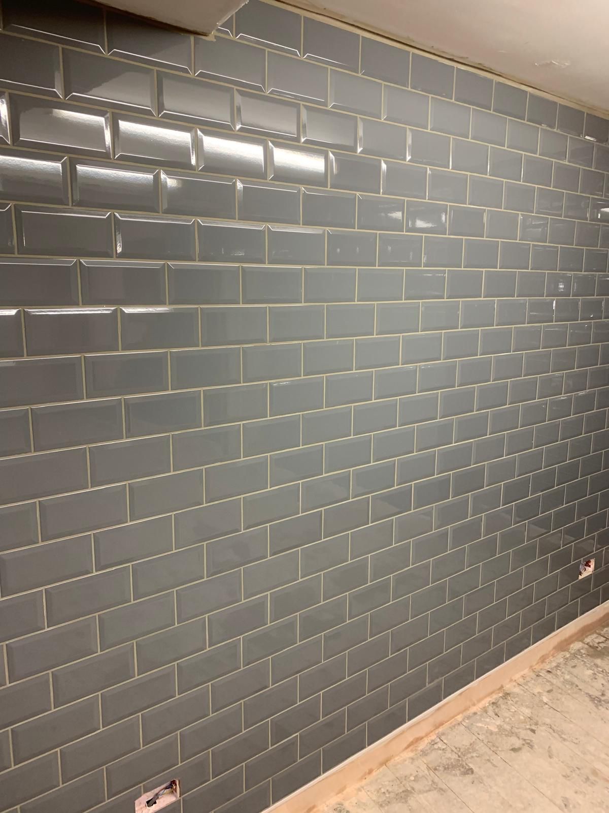 Completed grey bevelled metro wall tiling
